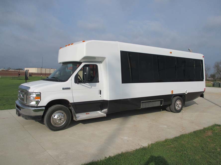 Left side view of white bus