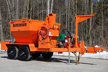 Orange road maintenance equipment in daylight